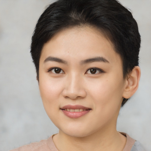 Joyful asian young-adult female with short  brown hair and brown eyes