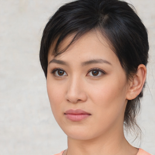 Neutral asian young-adult female with medium  brown hair and brown eyes