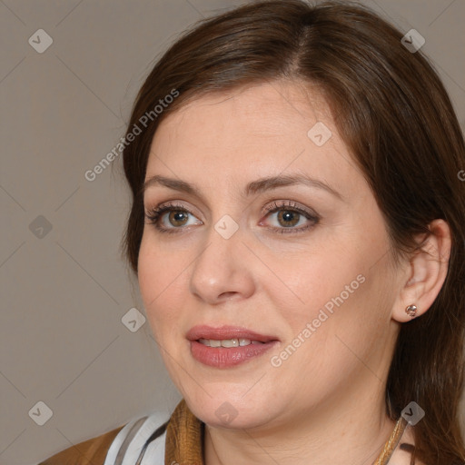 Joyful white adult female with medium  brown hair and brown eyes