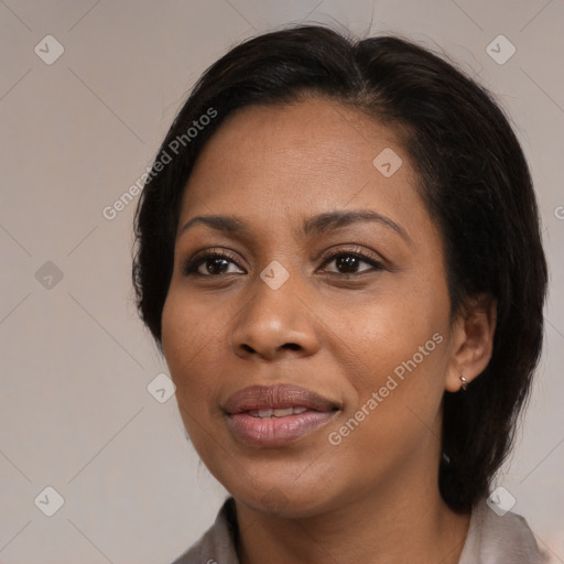 Joyful black young-adult female with medium  brown hair and brown eyes