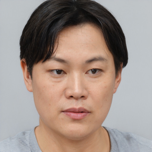 Neutral asian young-adult female with short  brown hair and brown eyes