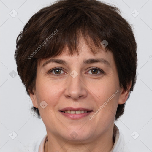 Joyful white adult female with short  brown hair and brown eyes