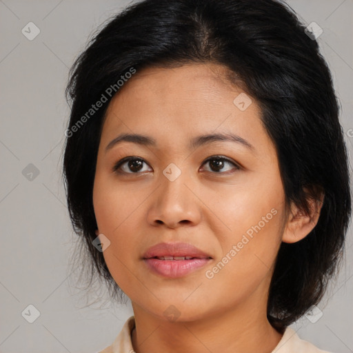 Joyful asian young-adult female with medium  black hair and brown eyes