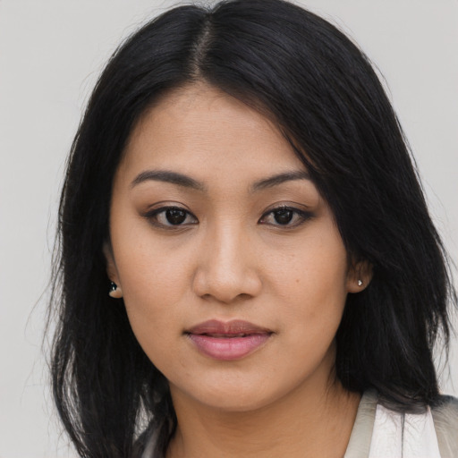 Joyful asian young-adult female with long  black hair and brown eyes