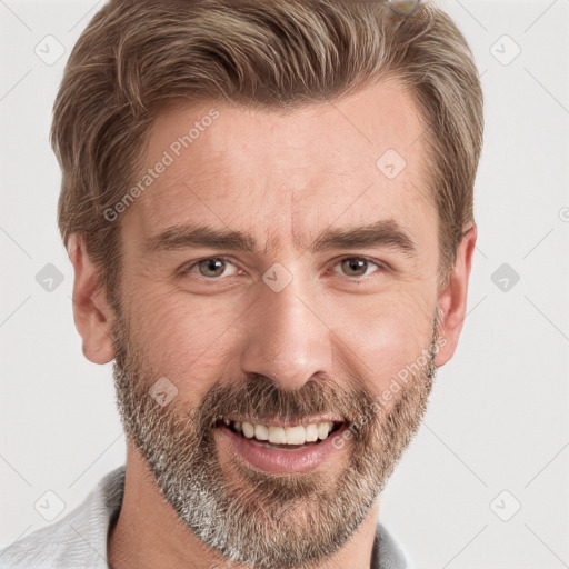 Joyful white adult male with short  brown hair and grey eyes