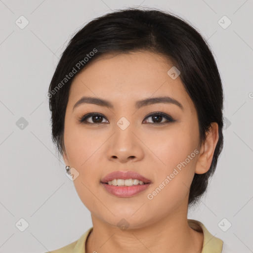 Joyful latino young-adult female with medium  black hair and brown eyes