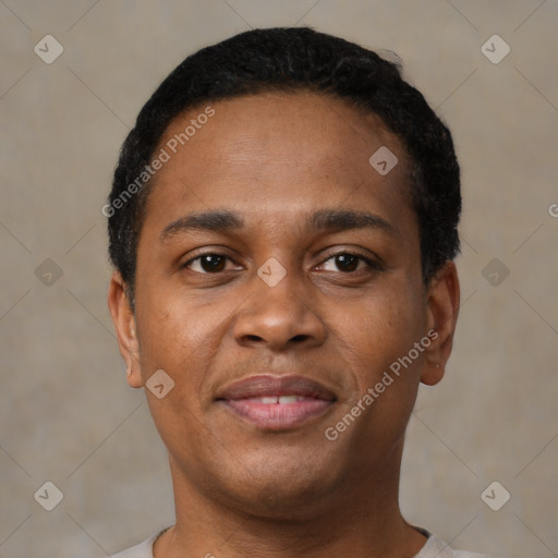 Joyful black young-adult male with short  black hair and brown eyes