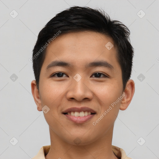 Joyful asian young-adult male with short  brown hair and brown eyes