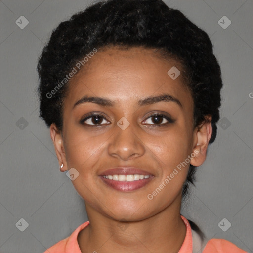 Joyful black young-adult female with short  black hair and brown eyes