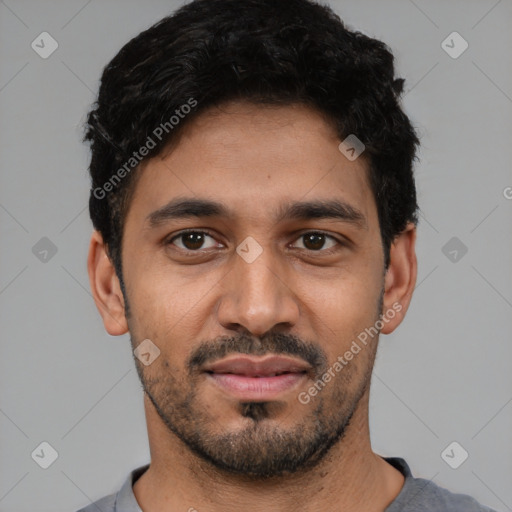 Joyful latino young-adult male with short  black hair and brown eyes