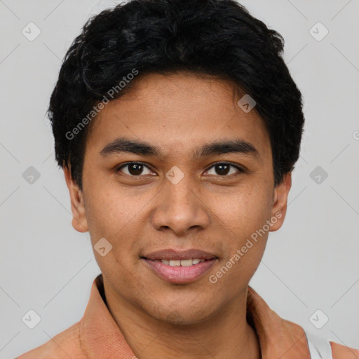 Joyful latino young-adult male with short  brown hair and brown eyes