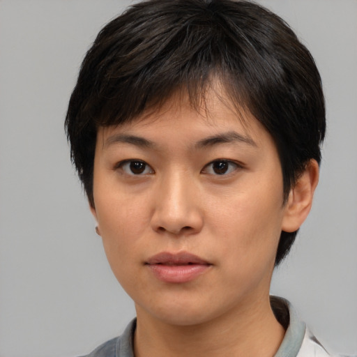 Neutral asian young-adult female with medium  brown hair and brown eyes