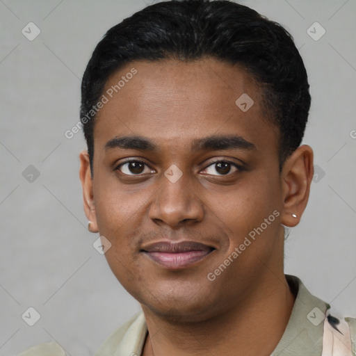 Joyful black young-adult male with short  black hair and brown eyes