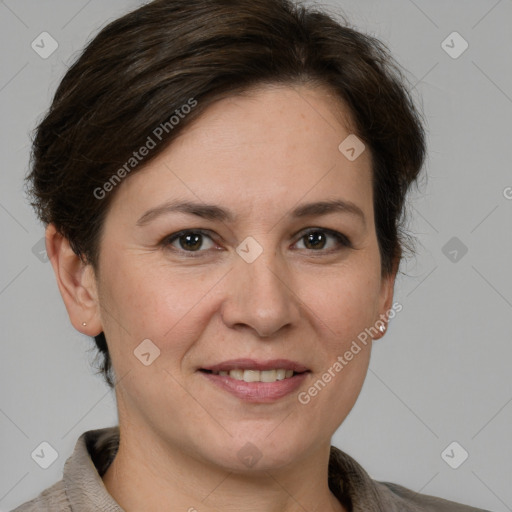 Joyful white adult female with short  brown hair and grey eyes