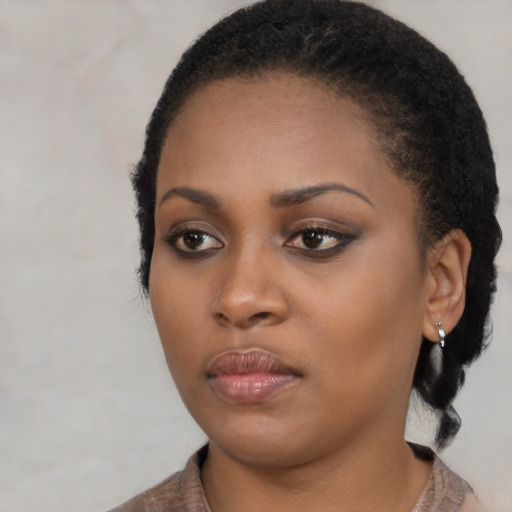 Neutral black young-adult female with medium  black hair and brown eyes