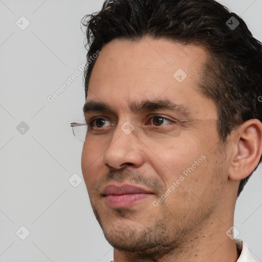 Joyful white adult male with short  brown hair and brown eyes