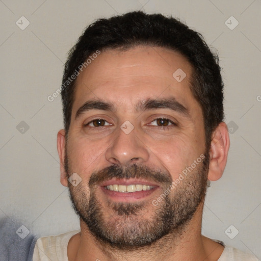 Joyful white adult male with short  black hair and brown eyes