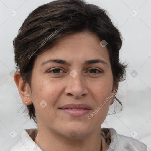 Joyful white adult female with medium  brown hair and brown eyes