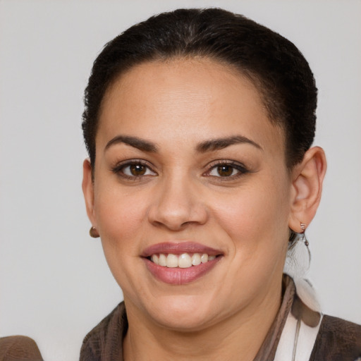 Joyful white young-adult female with short  brown hair and brown eyes