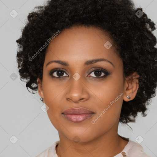 Joyful black young-adult female with medium  black hair and brown eyes