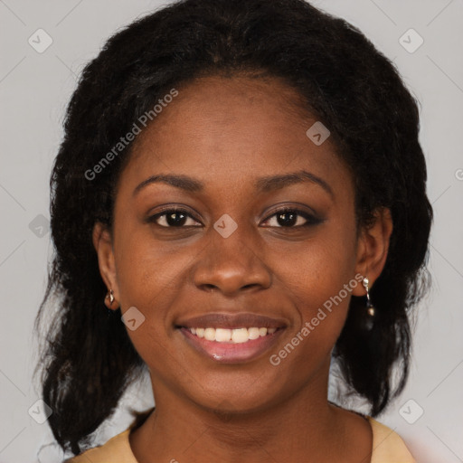 Joyful black young-adult female with medium  black hair and brown eyes