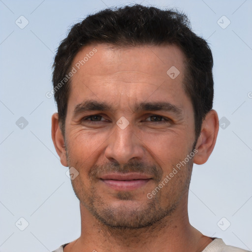 Joyful white adult male with short  brown hair and brown eyes