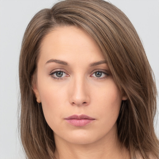 Neutral white young-adult female with long  brown hair and brown eyes