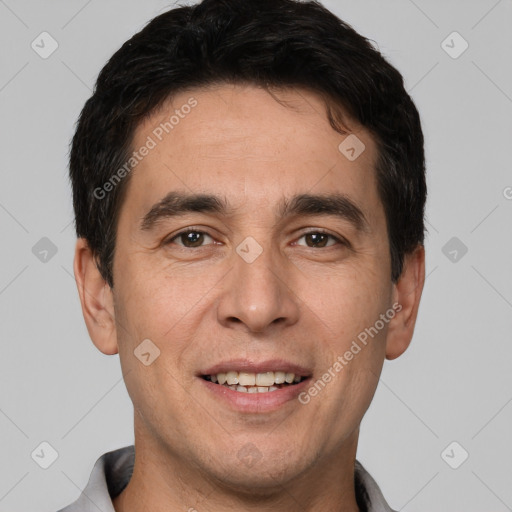 Joyful white adult male with short  brown hair and brown eyes