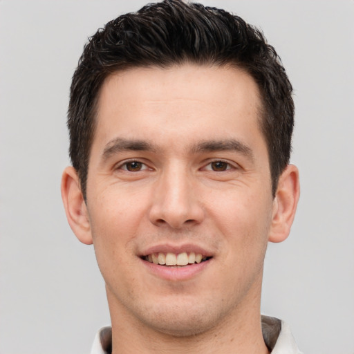 Joyful white young-adult male with short  brown hair and brown eyes