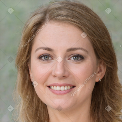 Joyful white young-adult female with long  brown hair and green eyes