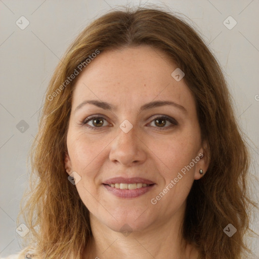 Joyful white adult female with long  brown hair and brown eyes