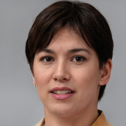 Joyful white young-adult female with medium  brown hair and brown eyes