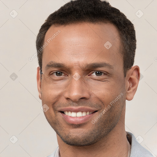 Joyful white young-adult male with short  brown hair and brown eyes