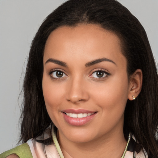 Joyful white young-adult female with long  brown hair and brown eyes