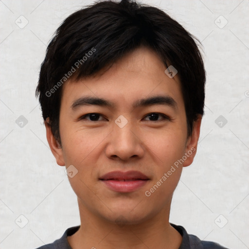 Joyful asian young-adult male with short  black hair and brown eyes