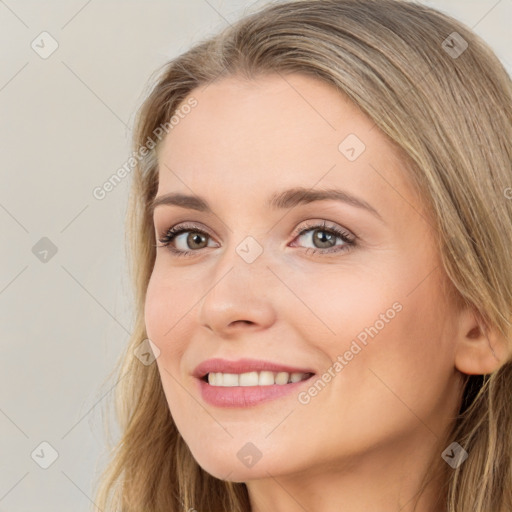 Joyful white young-adult female with long  brown hair and brown eyes