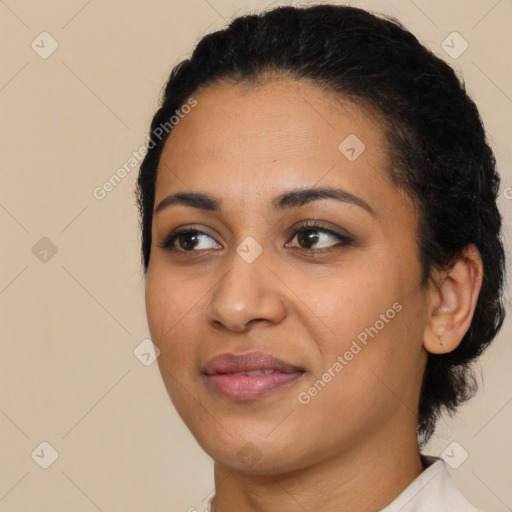 Joyful latino young-adult female with short  black hair and brown eyes