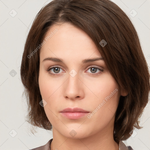 Neutral white young-adult female with medium  brown hair and brown eyes