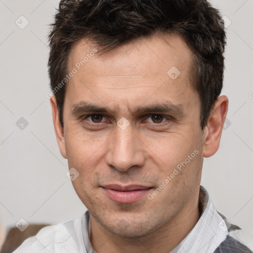 Joyful white adult male with short  brown hair and brown eyes