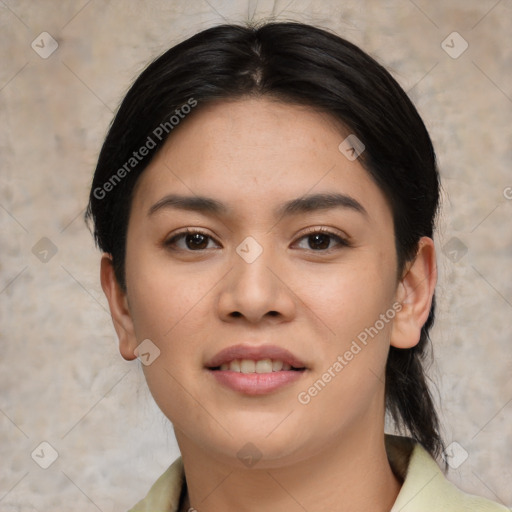 Joyful asian young-adult female with medium  black hair and brown eyes