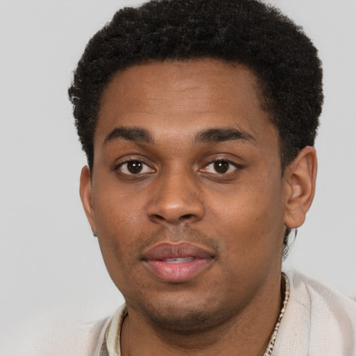 Neutral black young-adult male with short  brown hair and brown eyes