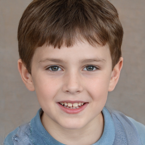 Joyful white child male with short  brown hair and grey eyes