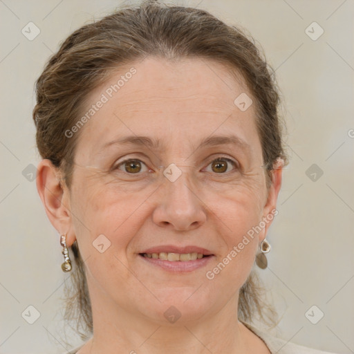 Joyful white adult female with short  brown hair and grey eyes