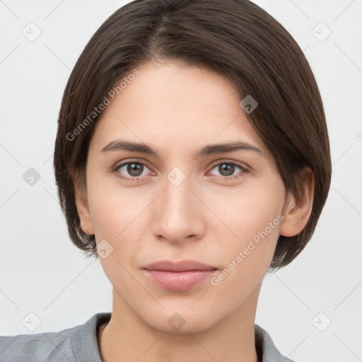 Neutral white young-adult female with short  brown hair and brown eyes