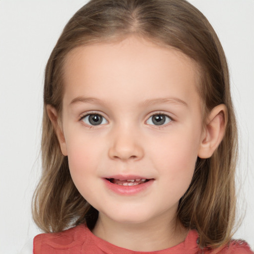 Joyful white child female with medium  brown hair and brown eyes