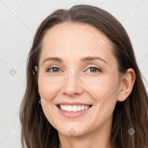 Joyful white young-adult female with long  brown hair and grey eyes