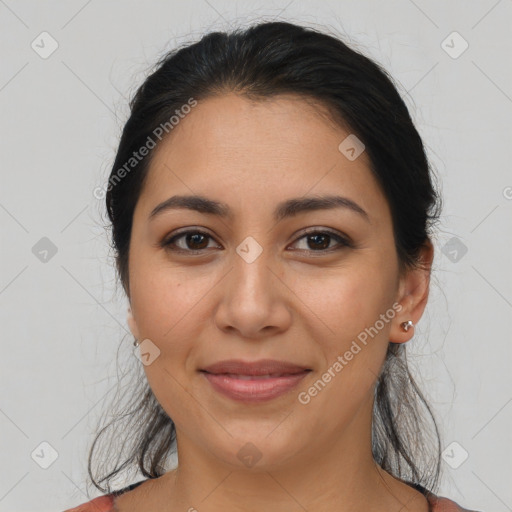 Joyful latino young-adult female with medium  brown hair and brown eyes