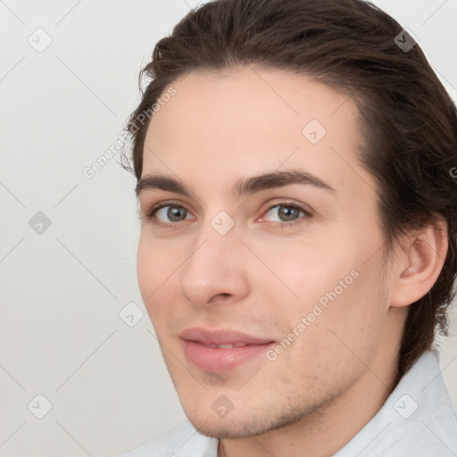 Joyful white young-adult male with medium  brown hair and brown eyes