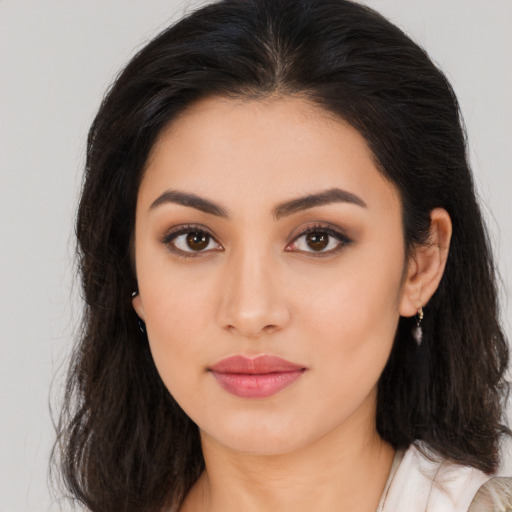Neutral latino young-adult female with long  brown hair and brown eyes