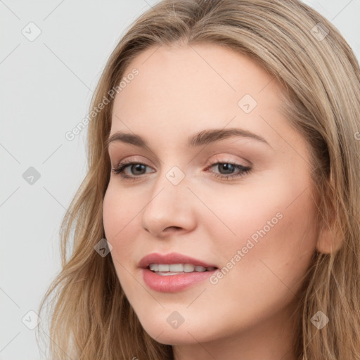 Joyful white young-adult female with long  brown hair and blue eyes